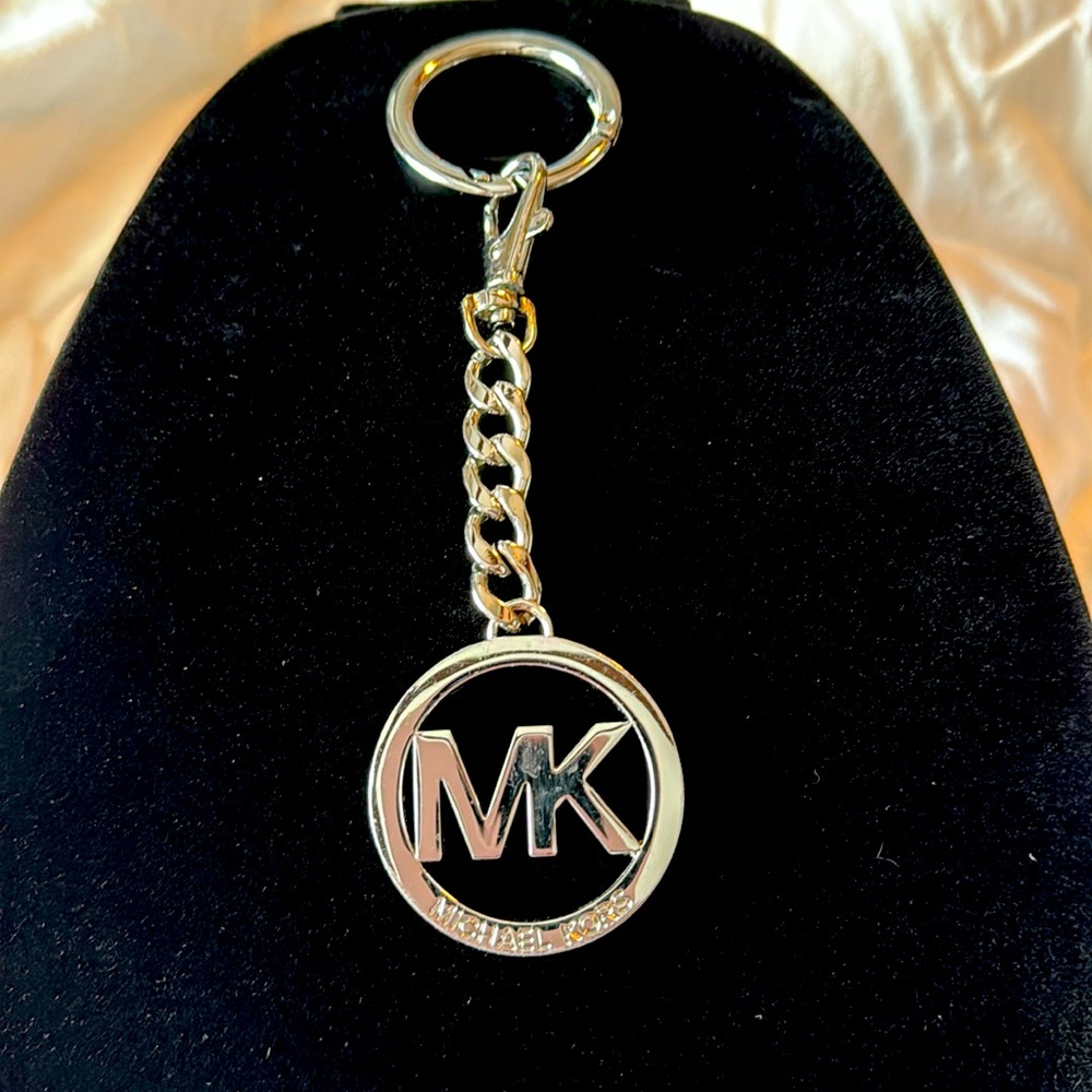 Authentic Michael Kors high end silver tone bag charm/ Keychain.